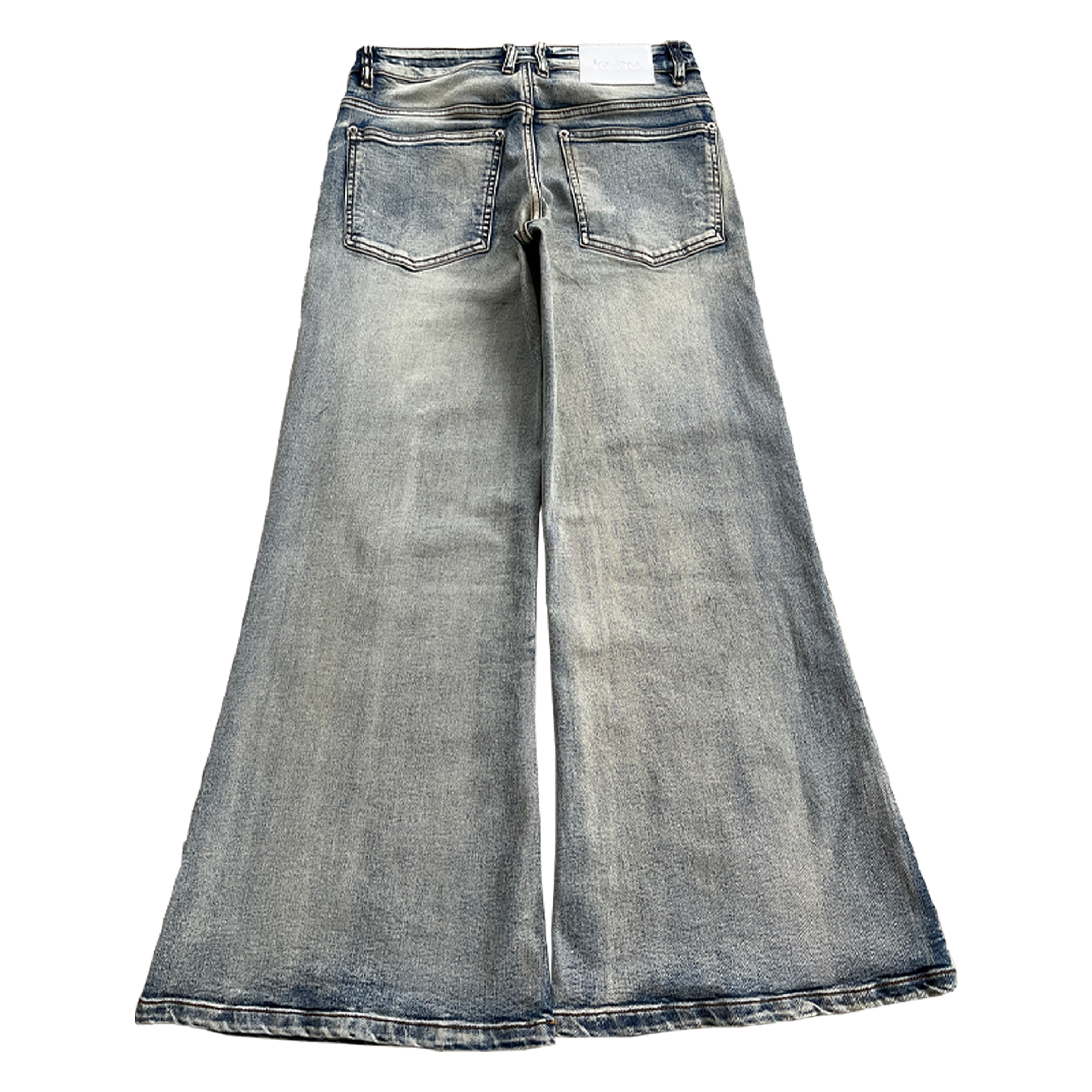A pair of light wash denim jeans with a flared leg, metal rivets on the pockets, a white leather patch, and a stone wash finish.